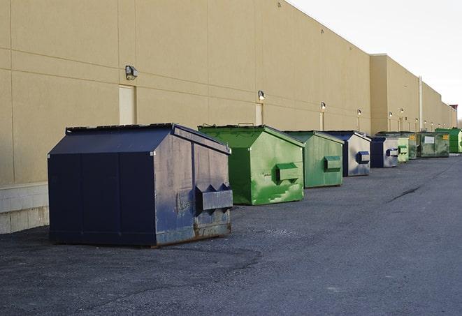 metallic dumpster units staged for construction garbage in Lovington